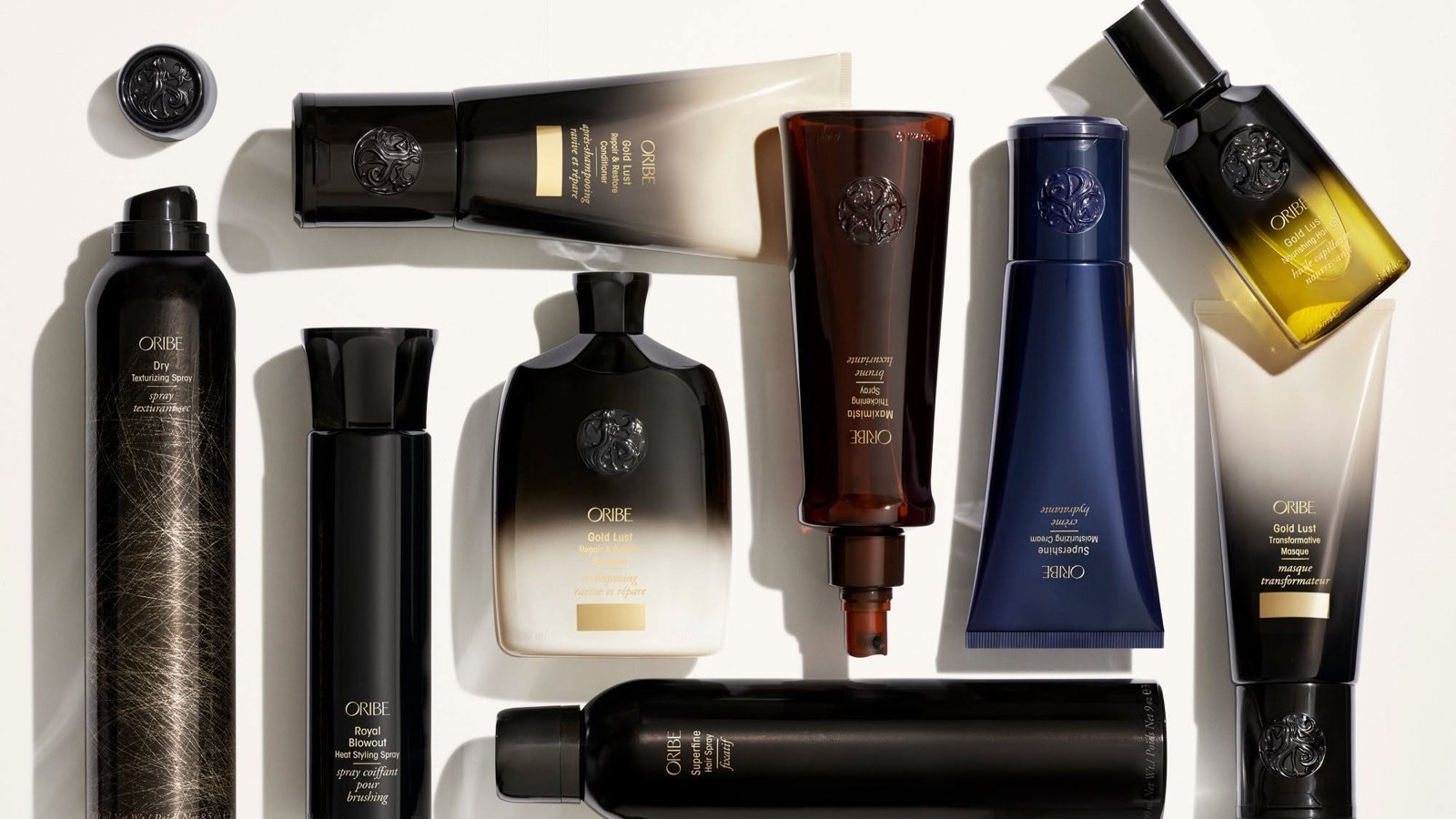 Коллекция средств Oribe на тёмном фоне